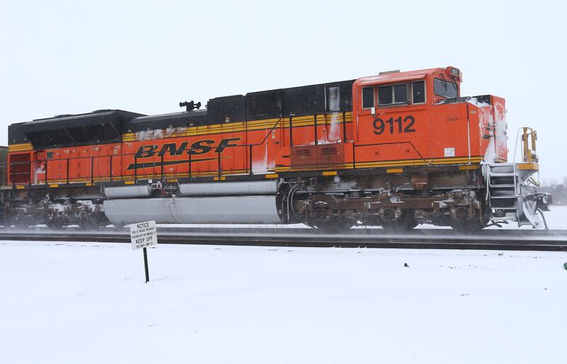 A BNSF train pushes through the snow as it heads west of Railroad Street on Wednesday, Feb. 2, 2022, in Princeton.