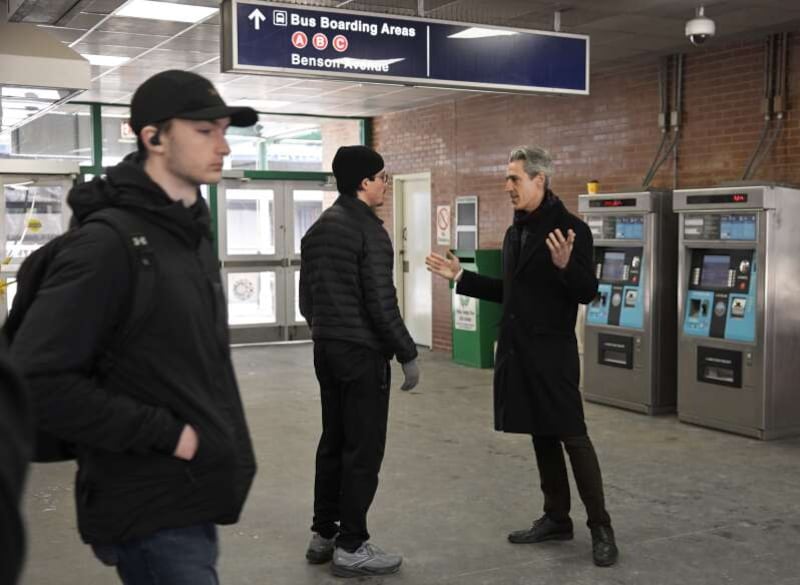 Congressional candidate and Evanston Mayor Daniel Biss talks with train riders at the Davis Street L stop in Evanston on Wednesday, March 18, 2026. Biss won the Democratic nomination for Illinois' 9th Congressional District seat the night before.