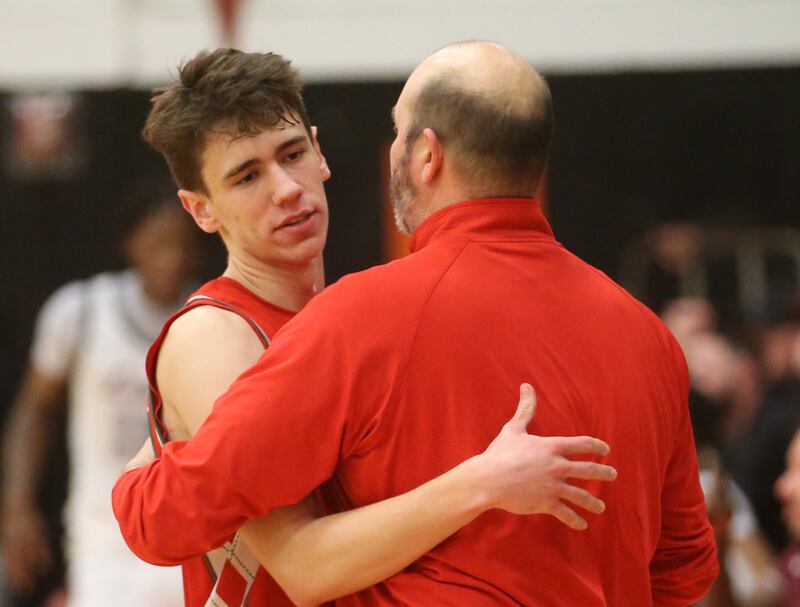 L-P's Nick Olivero hugs head coach John Senica after loosing to Peoria during the Class 3A Sectional semifinal game on Wednesday, March 5, 2025 at Washington High School.
