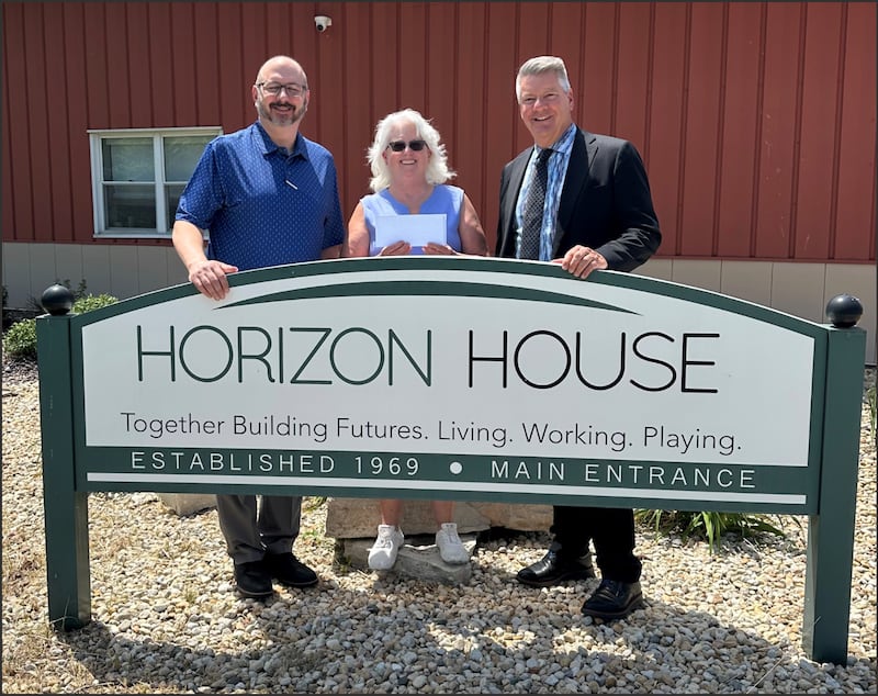 John McCormick, with Katie and Bart Hartauer for Horizon House donation.