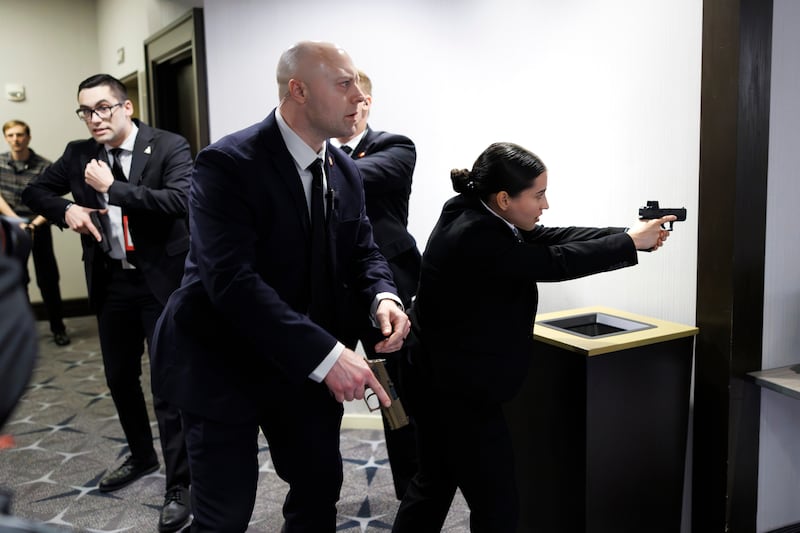 Members of law enforcement respond during the White House Correspondents Dinner, Saturday, April 25, 2026, in Washington. (AP Photo/Tom Brenner)