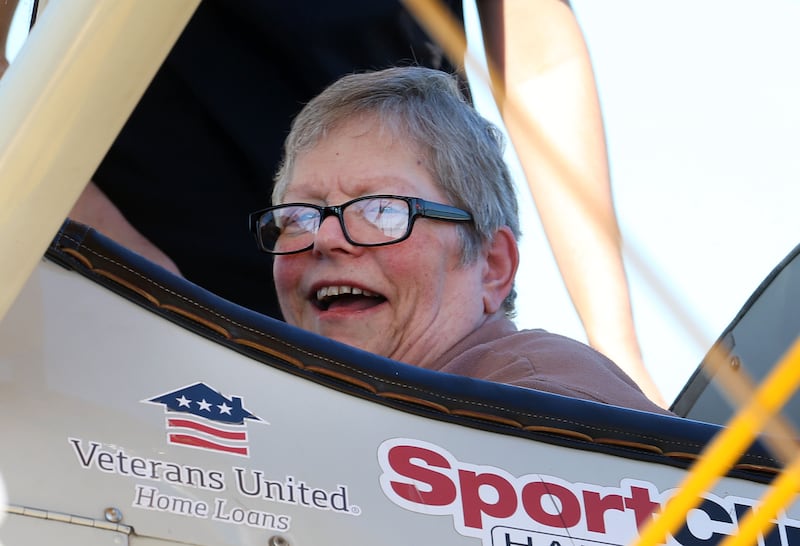 Veteran LeeAnn Joyce of Princeton, smiles while sitting in a 1942 Boeing Stearman A-75 Primary Trainer during a Veteran Dream Flight on Tuesday, Sept 2, 2025 at the Illinois Valley Regional Airport in Peru.