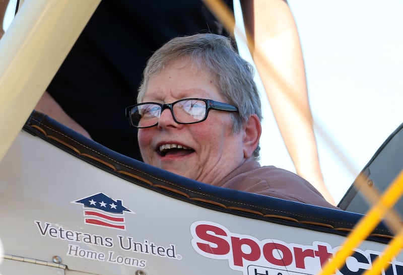 Veteran LeeAnn Joyce of Princeton, smiles while sitting in a 1942 Boeing Stearman A-75 Primary Trainer during a Veteran Dream Flight on Tuesday, Sept 2, 2025 at the Illinois Valley Regional Airport in Peru.