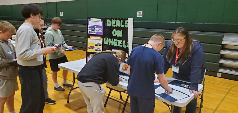 Students use their allotted money to make purchases during the Grundy Area Vocational Center's "Welcome to the Real World" simulation on March 25 and 26.