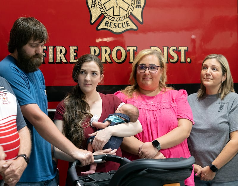 Ryan, Cheyenne and Wilder Edwards meet and thank Lee County Dispatchers Kelly Boos (left) and Jesica Knipple Thursday, May 15, 2025.