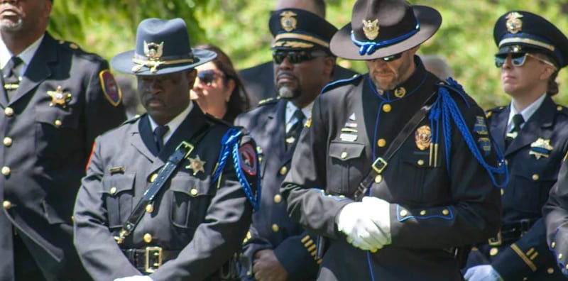 Members of the honor guard stand during an annual ceremony honoring fallen Illinois law enforcement officers. The ceremony honored a Chicago police officer and Park Forest detective who died while on duty in 2025.