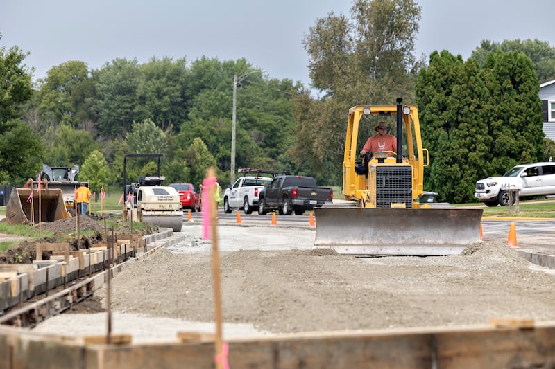 Workers with Stitcher Construction of Erie work on the new parking area at Thomas Park in Sterling on Thursday, Aug. 7, 2025. The new lot will help alleviate local congestion for the popular pickleball courts.