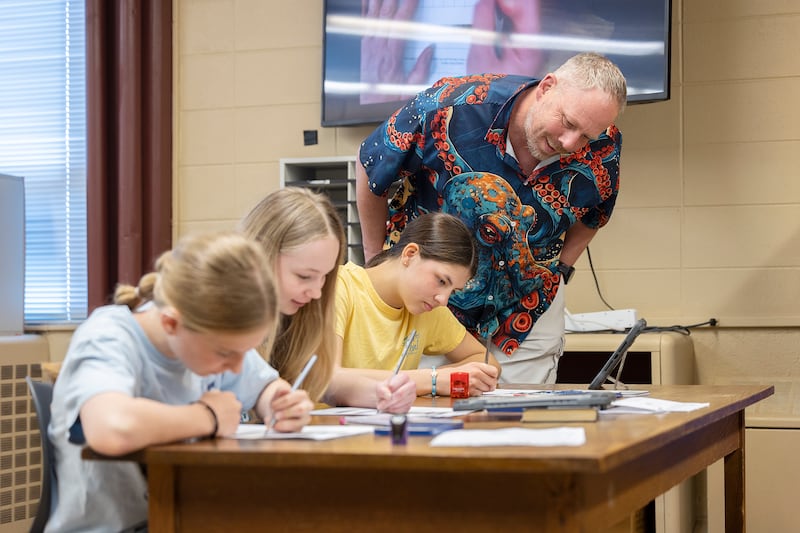 Sterling Challand Middle School art teacher Scott James teaches a technique on shading to his 6th grade students.