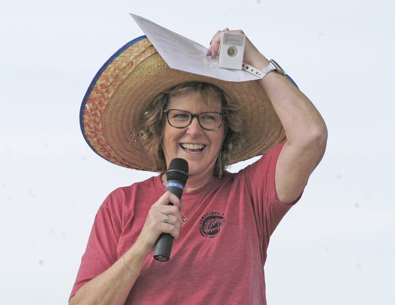 Melinda Jones, Director of RF Tourism, holds on to her hat on a windy day at the Taco Throwdown Events Sponsored by Rock Falls Tourism. Event at RB&W District September 27th, 2024.