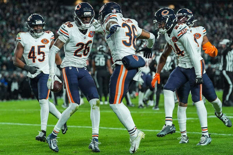 Chicago Bears cornerback Nahshon Wright (26) celebrates his fumble recovery with safety Jonathan Owens (36) during the second half of an NFL football game, Friday, Nov. 28, 2025, in Philadelphia. (AP Photo/Matt Rourke)