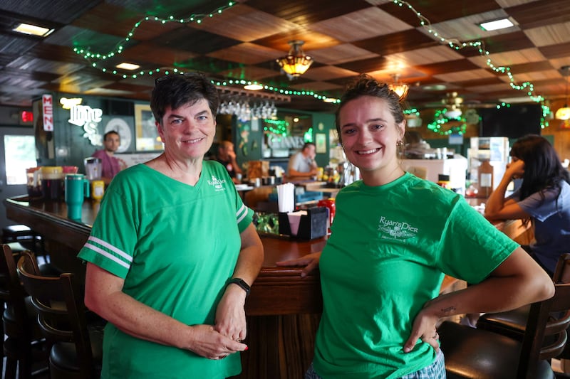 Kathleen Slavin, left, co-owner of Ryan's Pier, stands with her daughter, Kyra, at the Aroma Park business on Tuesday, Aug. 12, 2025. The restaurant has been celebrating its 40th anniversary this year.