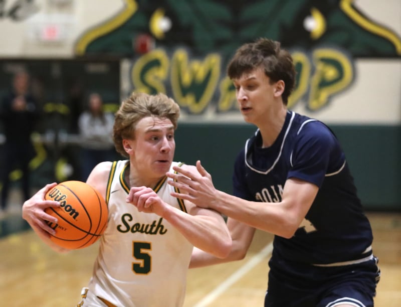 Crystal Lake South's Carson Trivellini drives to the basket agains tCary-Grove's Evan Bauer during a Fox Valley Conference boys basketball game on Friday, Jan. 23, 2026, at Crystal Lake South High School.