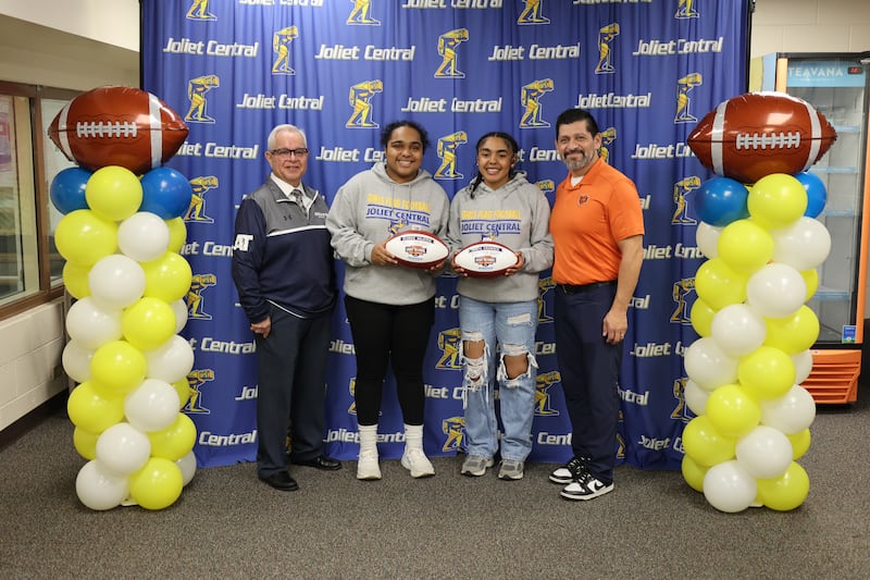 Joliet Central High School students Georgianna Majerus and Amaya Crowder were named Chicago Bears Community High School All-Stars by Gustavo Silva, Chicago Bears Director of Football Development, and Saul Ramirez, Athletico Physical Therapy.
