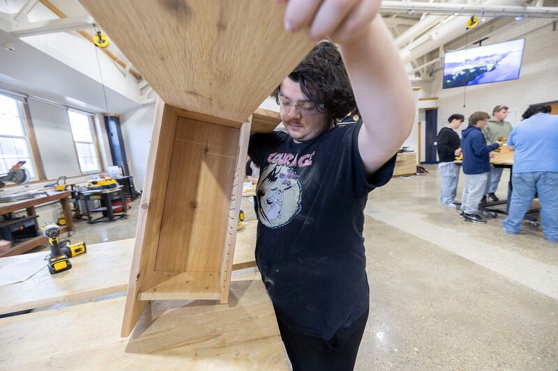 Sterling High School student Christian Cardott displays the wood duck house Monday, Nov. 10, 2025, he built recently. The class was asked to build the houses for a local conservation group.