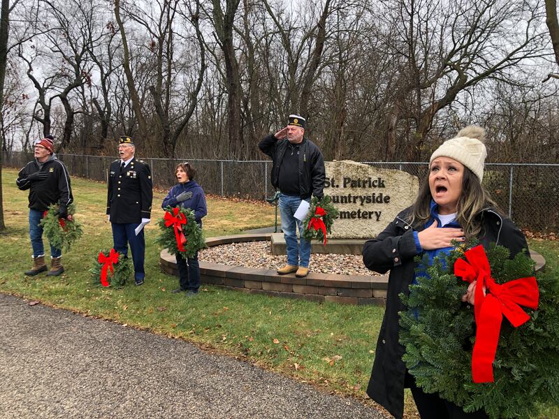 The McHenry American Legion Post 491 laid 288 wreaths at two McHenry cemeteries on Sunday, Dec. 15, 2024. Speaking, and offering prayers, before the wreaths were laid are, from left, McHenry Sons of the American Legion chaplain Richard Clements, McHenry American Legion chaplain Carl Kamienski, and McHenry American Legion Auxiliary chaplain Sharon Nye, Post Commander Chad Miller and Legion Auxiliary Vice President Susan Yon Hanson.