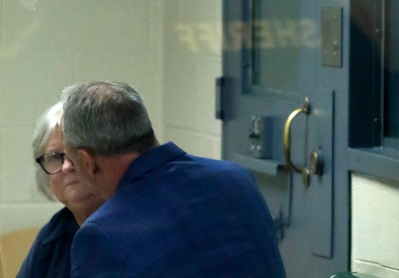 Roxanna L. Collins of McHenry talks with lawyer Patrick Cafferty as she waits to be taken into court in Kenosha County on Monday, June 2, 2025, before what was to be her first appearance. The hearing was delayed. She was charged with first-degree intentional homicide in the 2003 death of her husband, David Vanderzee.