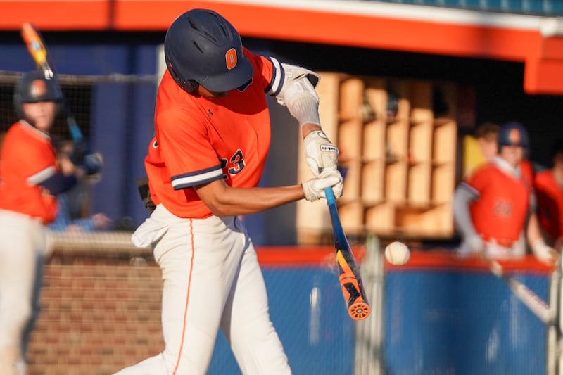 Oswego’s Kamrin Jenkins (23) slaps a two run double against Plainfield East during a baseball game at Oswego High School on Tuesday, April 9, 2024.