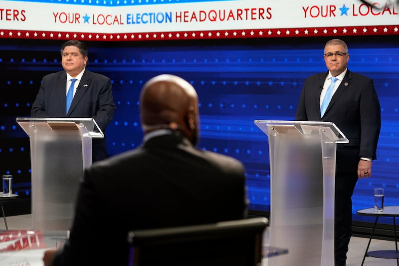 FILE - Illinois Gov. JB Pritzker, left, and Republican gubernatorial challenger state Sen. Darren Bailey participate in the Illinois Governor's Debate at the WGN9 studios, Oct. 18, 2022, in Chicago. (AP Photo/Charles Rex Arbogast, File)