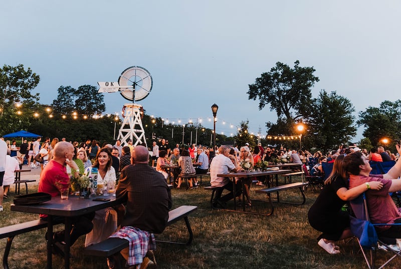 Community members help raise funds for Batavia's MainStreet's support for local businesses at the annual 'Cocktails in the Park' fundraiser.