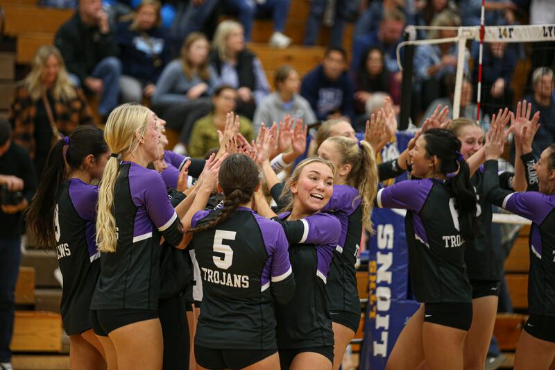 Downers Grove North celebrates their win over Downers Grove South in the Class 4A Lyons Sectional Semifinal volleyball match. Nov 4, 2025 in La Grange.