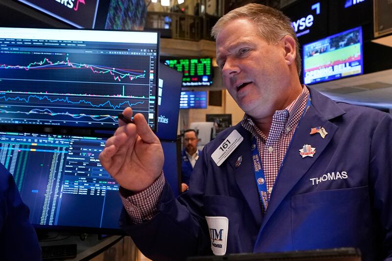 Trader Thomas McCauley works on the floor of the New York Stock Exchange, Friday, May 9, 2025. (AP Photo/Richard Drew)