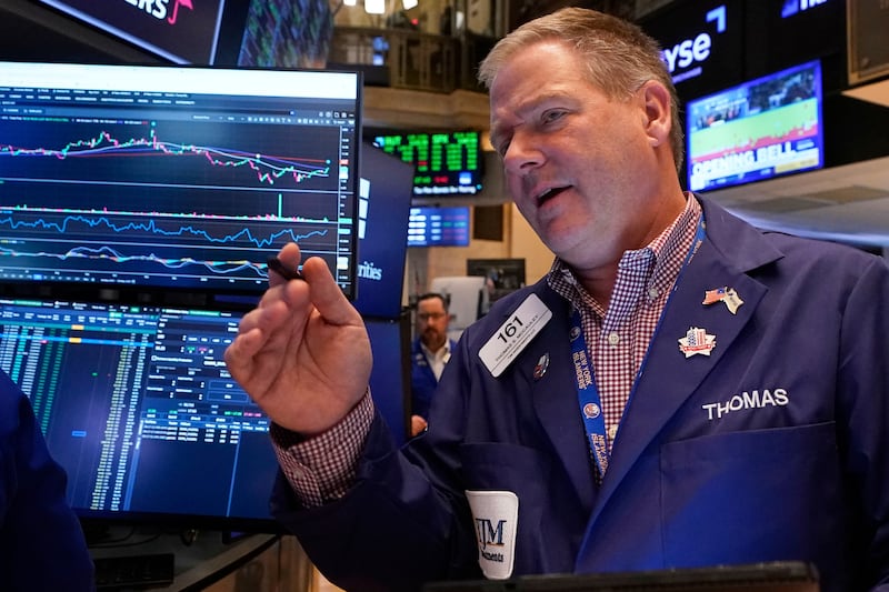 Trader Thomas McCauley works on the floor of the New York Stock Exchange, Friday, May 9, 2025. (AP Photo/Richard Drew)