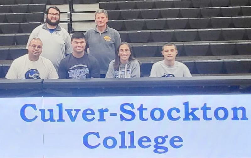 Putnam County High School senior Alex Rodriguez, who medaled at state in both the discus and shot put last spring, signs to throw at Culver-Stockton College next year. Pictured are (front row, from left) Vic Rodriguez (father), Alex Rodriguez, Carmela Rodriguez (mother) and Isaac Rodriguez (brother) and (back row) Culver-Stockton head  track & field coach Hunter Davis and PCHS track & field coach Chuck McConnell.