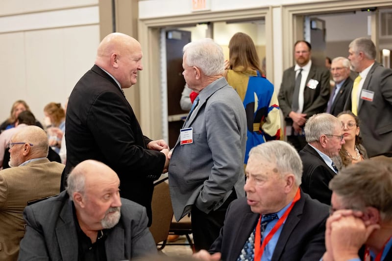 U.S. Rep. Glenn “GT” Thompson, R-Pennsylvania (left), mingles with Illinois Farm Bureau members during the Governmental Affairs Leadership Conference.