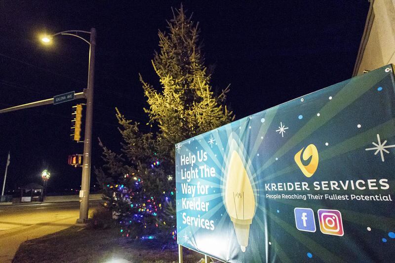 Lights shine on the bottom branches of the Kreider tree Thursday December 10 at the corner of River Road and Galena Avenue in Dixon. The community can help Kreider Services light the tree this year by donating. Each $25 donation will light a bulb on the tree.