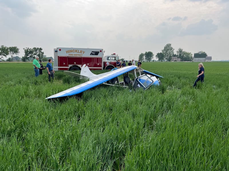 The remains of a 1946 Aeronca Champion 7AC single-engine plane lay in a farm field west of Hinckley Airfield on Saturday, June 7, 2025. The crash killed a 51-year-old pilot from Maple Park and injured a 3-year-old passenger, according to the DeKalb County Sheriff's Office.