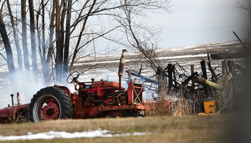 Smoke rises from the charred remains of a barn located at 14765 W. Milledgeville Rd., west of Polo, on Saturday, Dec. 20, 2025 following an evening fire on Friday, Dec. 19. The barn housed tractors and other machinery. No injuries were reported.