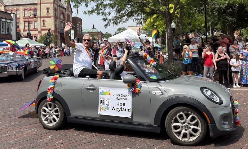 Grand Marshal Joe Weyland waves during the Woodstock Pride parade June 15, 2025.