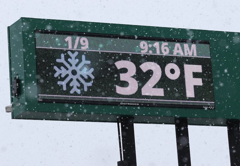 The sign at the First Nation Bank tells it all as temperatures are just cold enough to make the precipitation snow rather than rain Tuesday, Jan. 9, 2024, in DeKalb. Snow is expected to continue throughout the day with 7 to 10 inches of snow expected.