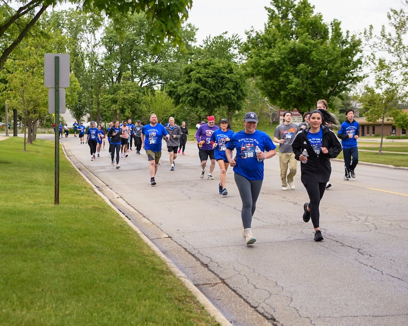 Participants take to the streets on Sunday May 25, 2025, during the Race to the Flag 5k held at Ty Warner Park in Westmont.