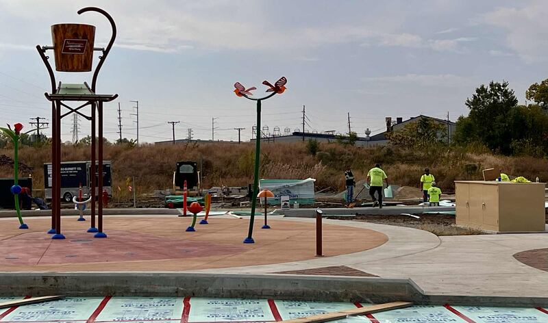 Crews work to install the new ice skating ribbon at Sterling’s Northwestern Steel and Wire Park, part of the city’s ongoing Riverfront Reimagined development project.