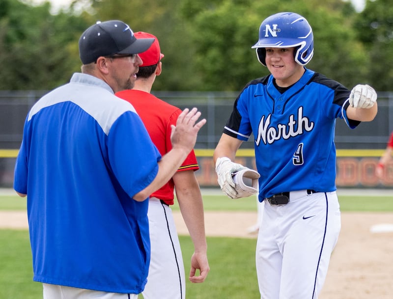 St. Charles North third baseman Matt Kelly waves to friends on the sidelines after a hit during the Class 4A Regional semifinal against Batavia at Batavia High School in Batavia on Thursday, May 29, 2025.