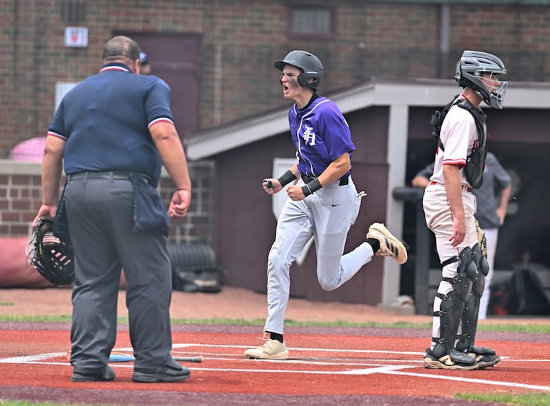 Downers Grove North's Sam Marshall (14) crosses home plate for a score during the 4A Lockport sectional game against Naperville Central on Saturday, JUNE. 06, 2026, at Lockport.