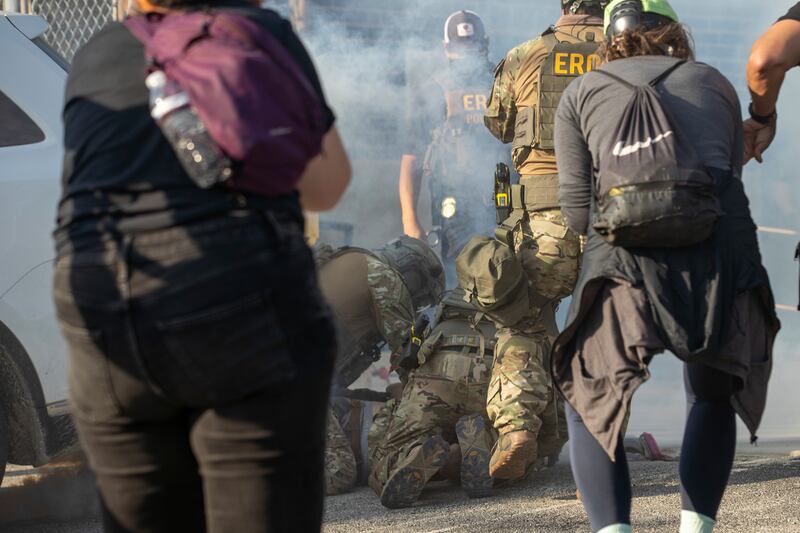 Immigration and Customs Enforcement officers arrest a protester at the ICE facility in Broadview, Friday, Sept. 19, 2025. (Zubaer Khan /Chicago Sun-Times via AP)