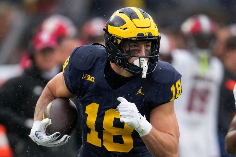 Michigan tight end Colston Loveland catches a pass against Indiana in the second half of an NCAA college football game in Ann Arbor, Mich., Saturday, Oct. 14, 2023. (AP Photo/Paul Sancya)