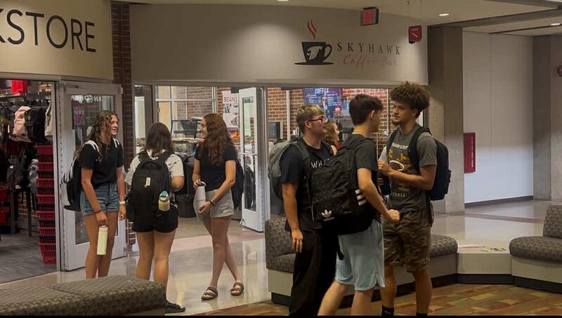 Students reconnect between classes on the first day of the fall semester at Sauk Valley Community College in Dixon, Monday, Aug. 11, 2025.