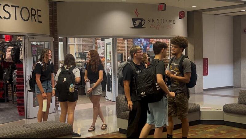Students reconnect between classes on the first day of the fall semester at Sauk Valley Community College in Dixon, Monday, Aug. 11, 2025.