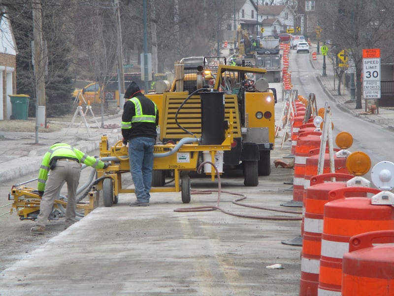 A construction crew this week works on a section of Center Street where a Joliet water main replacement project began last year. Feb. 26, 2025