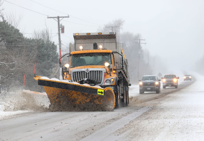 A snowplow clears the roads Saturday, Nov. 29, 2025, on Main Street in Elburn. Heavy snowfall throughout Saturday will cause hazerdous road conditions in northern Illinois.