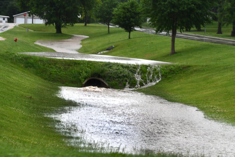 Nearly three inches of rain fell across Ogle County on Thursday evening, June 11, 2026 as a strong storm system moved across northern Illinois. Here, runoff water fills a ditch along state Route 64 on the west side of Oregon. The heavy downpours caused some flash flooding throughout the area.