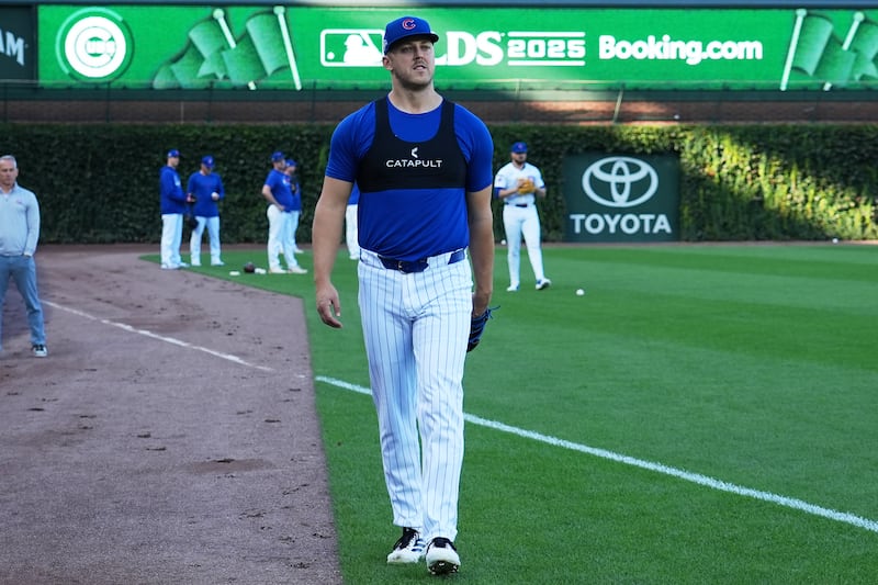 Chicago Cubs pitcher Jameson Taillon walks to the dugout during batting practice, Tuesday, Oct. 7, 2025, in Chicago, the day before Game 3 of the National League Division Series against the Milwaukee Brewers. (AP Photo/Nam Y. Huh)