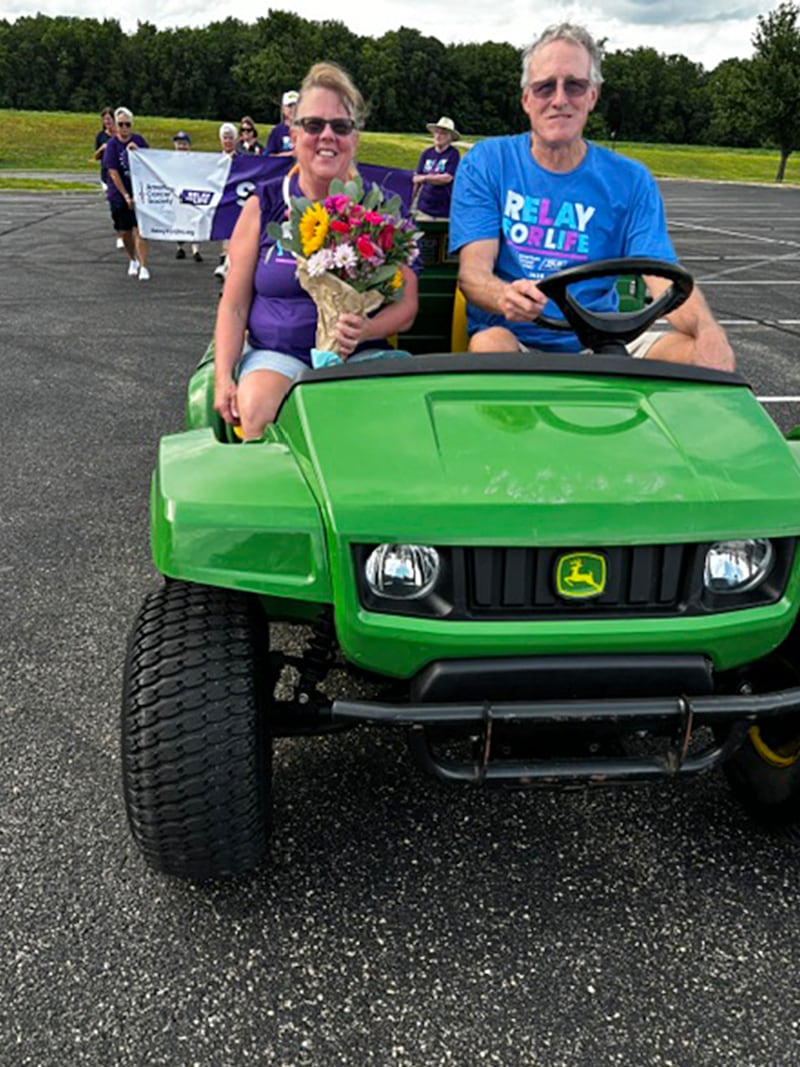 Angel Eigsti and Mike Donnelly lead the survivors lap Saturday, June 13, 2026, at the Relay for Life of the Sauk Valley. Eigsti is the longest survivor of the event, beating cancer 60 years ago.