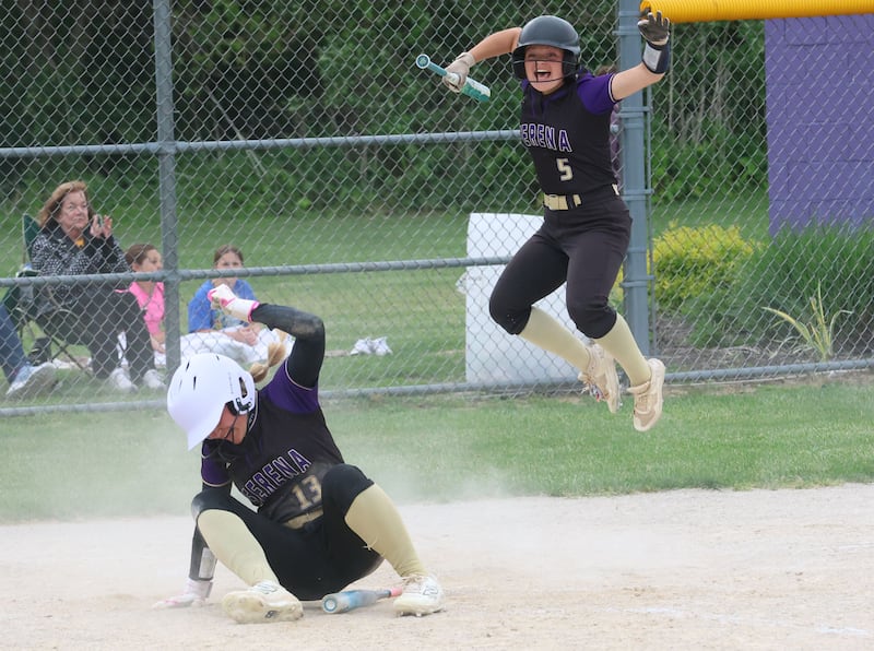 Serena's Brynley Glade scores the teams first run as teammate Finley Brodbeck reacts during the Class 1A Regional title game on Friday, May 22, 2026 at Serena High School.