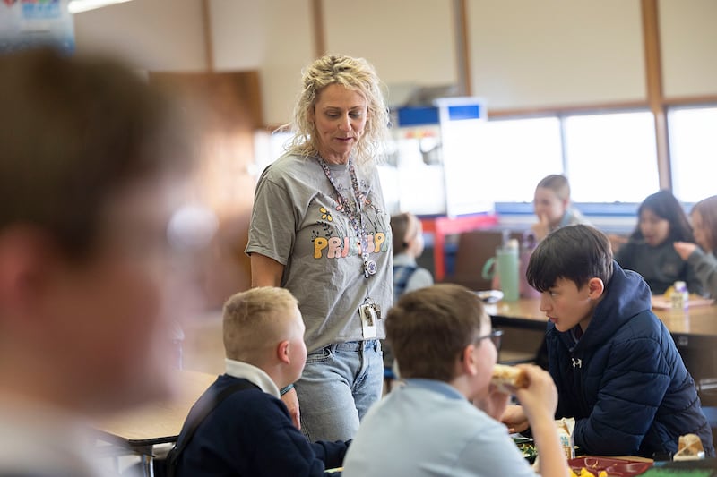St. Anne’s principal Talarie Bilharz chats with students over lunch Tuesday, March 17, 2026. Bilharz is one of seven Illinois principals up for the Golden Apple award.