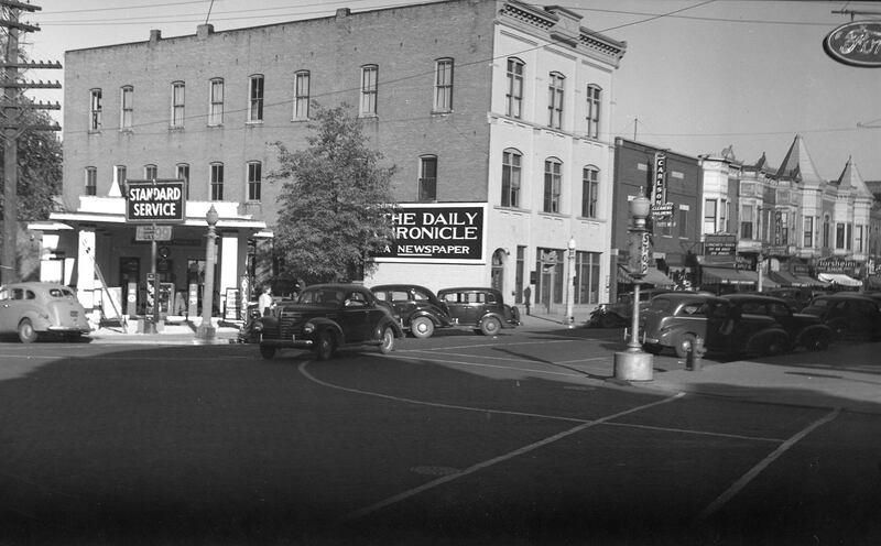 The Daily Chronicle Building and Whitney's Standard Station looking northeast in DeKalb before the station's 1940 remodel.