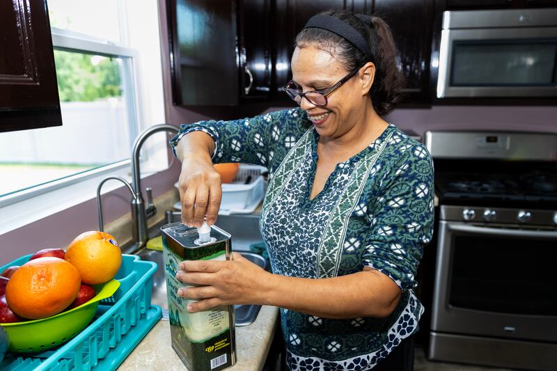 Aicha Kaltsos, who has utilized Northern Illinois Food Bank’s Project DASH program, makes dinner for her family in Joliet on Sept. 17, 2025.
